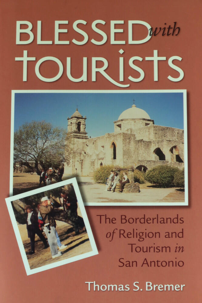 Blessed with Tourists cover The cover of the book Blessed with Tourists features a historic San Antonio Spanish mission church with visitors outside, while an inset photo in the lower left shows a tourist getting a photo. Author: Thomas S. Bremer.
